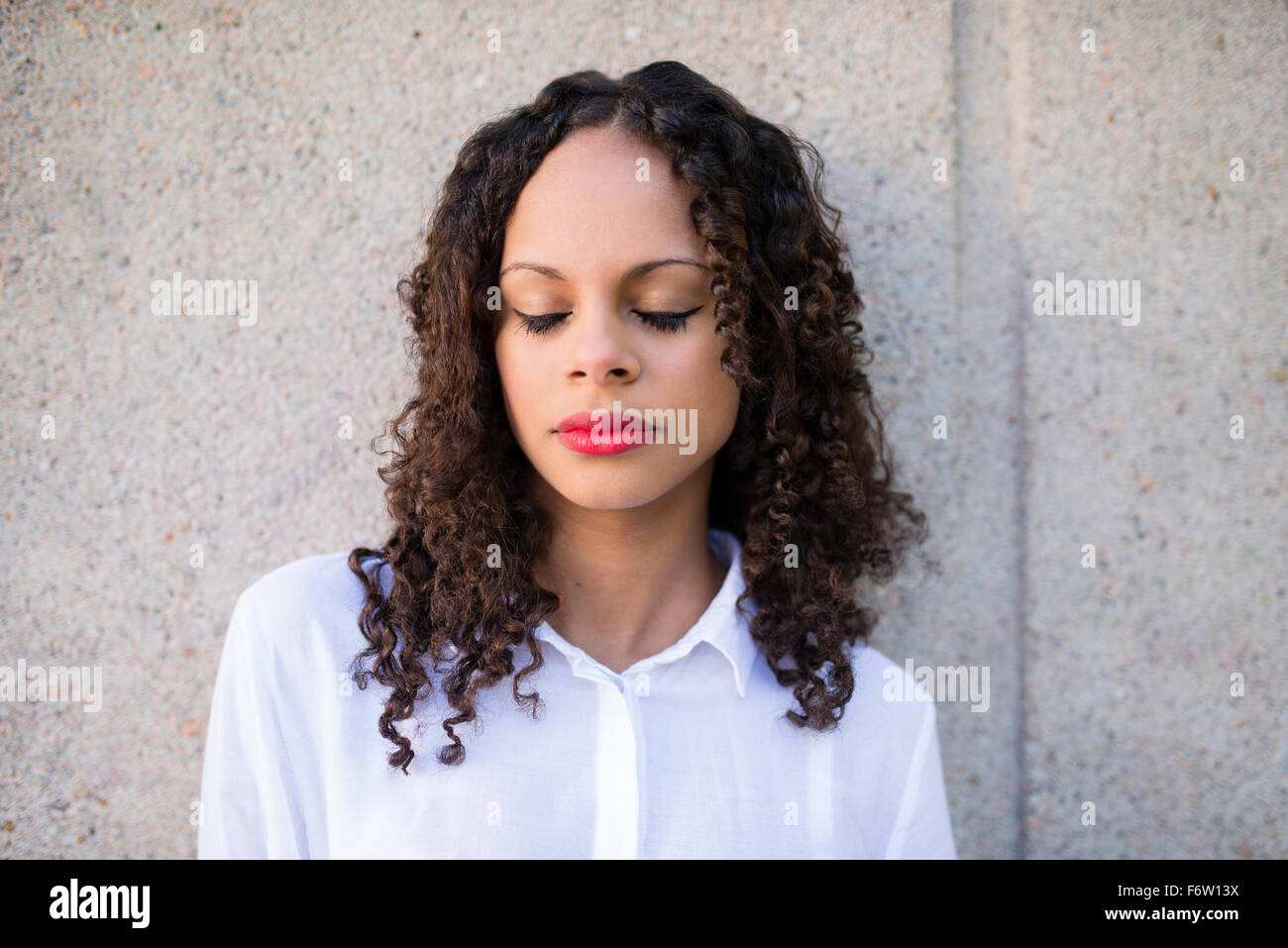 Portrait of young woman with closed eyes Stock Photo - Alamy