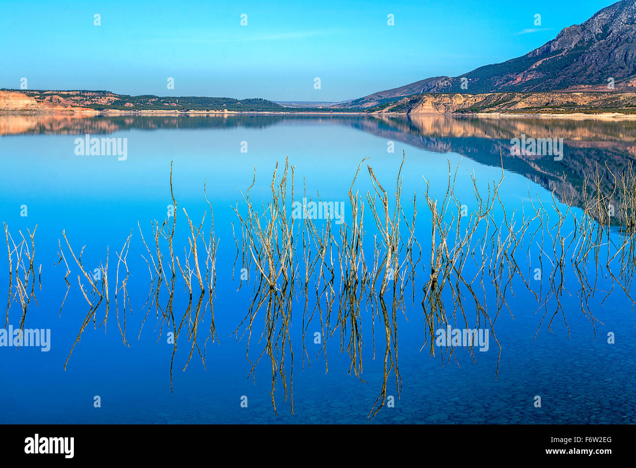 Large lake In Andalusia Spain, reflecting the surrounding countryside. Stock Photo