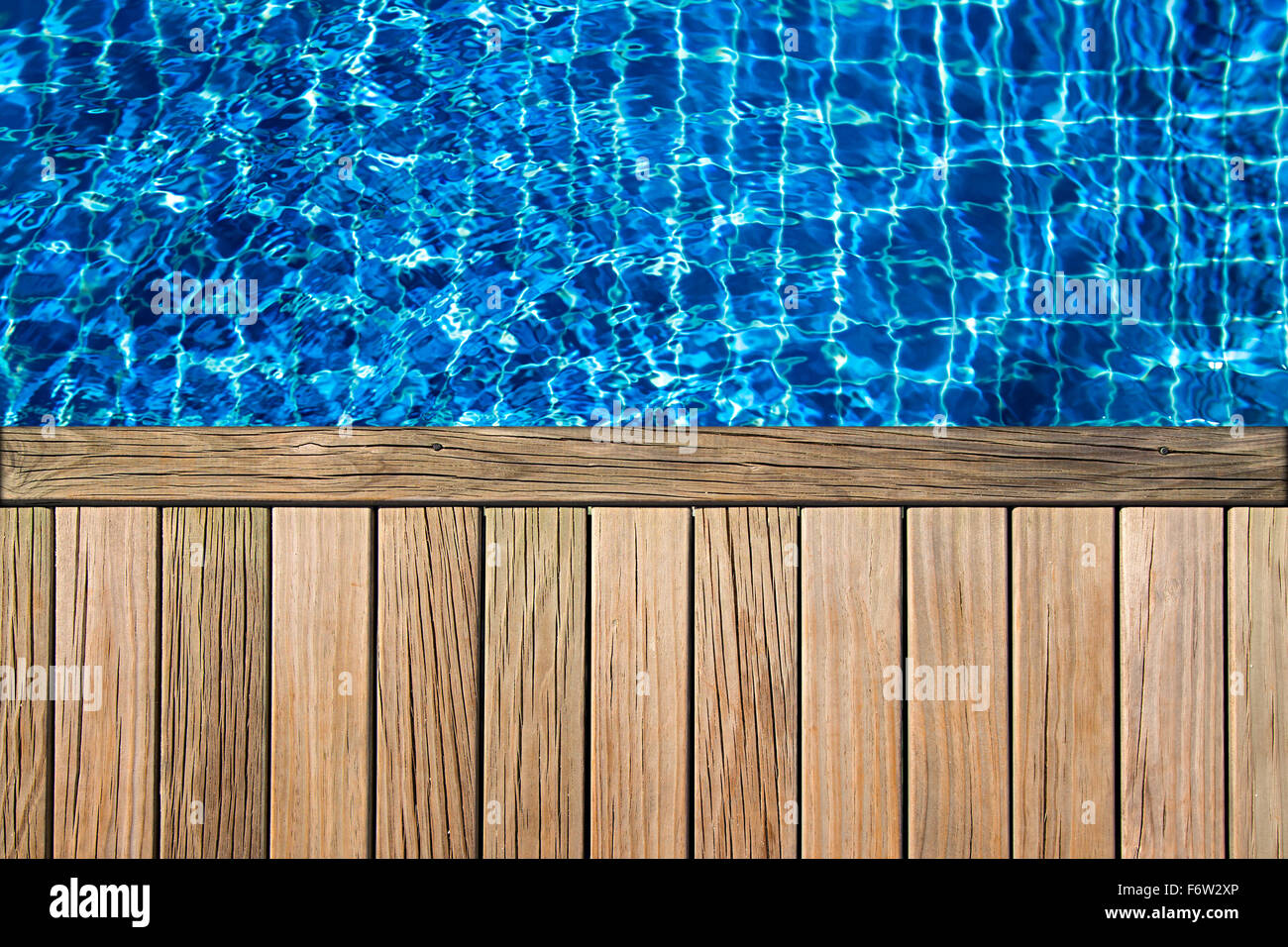wooden planks above swimming pool surface Stock Photo