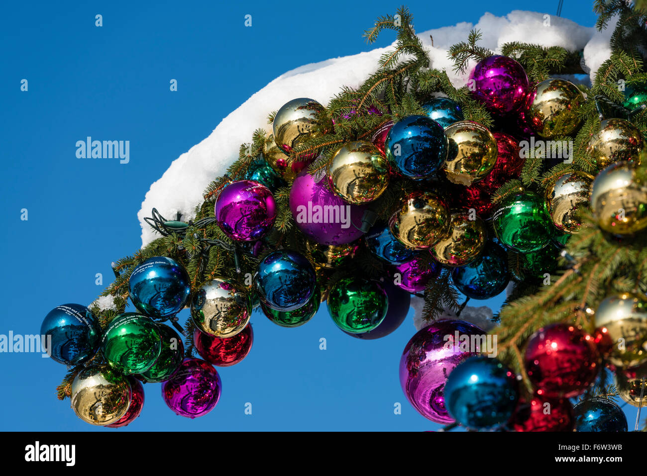 Colourful Christmas ball ornaments on a giant Christmas tree on