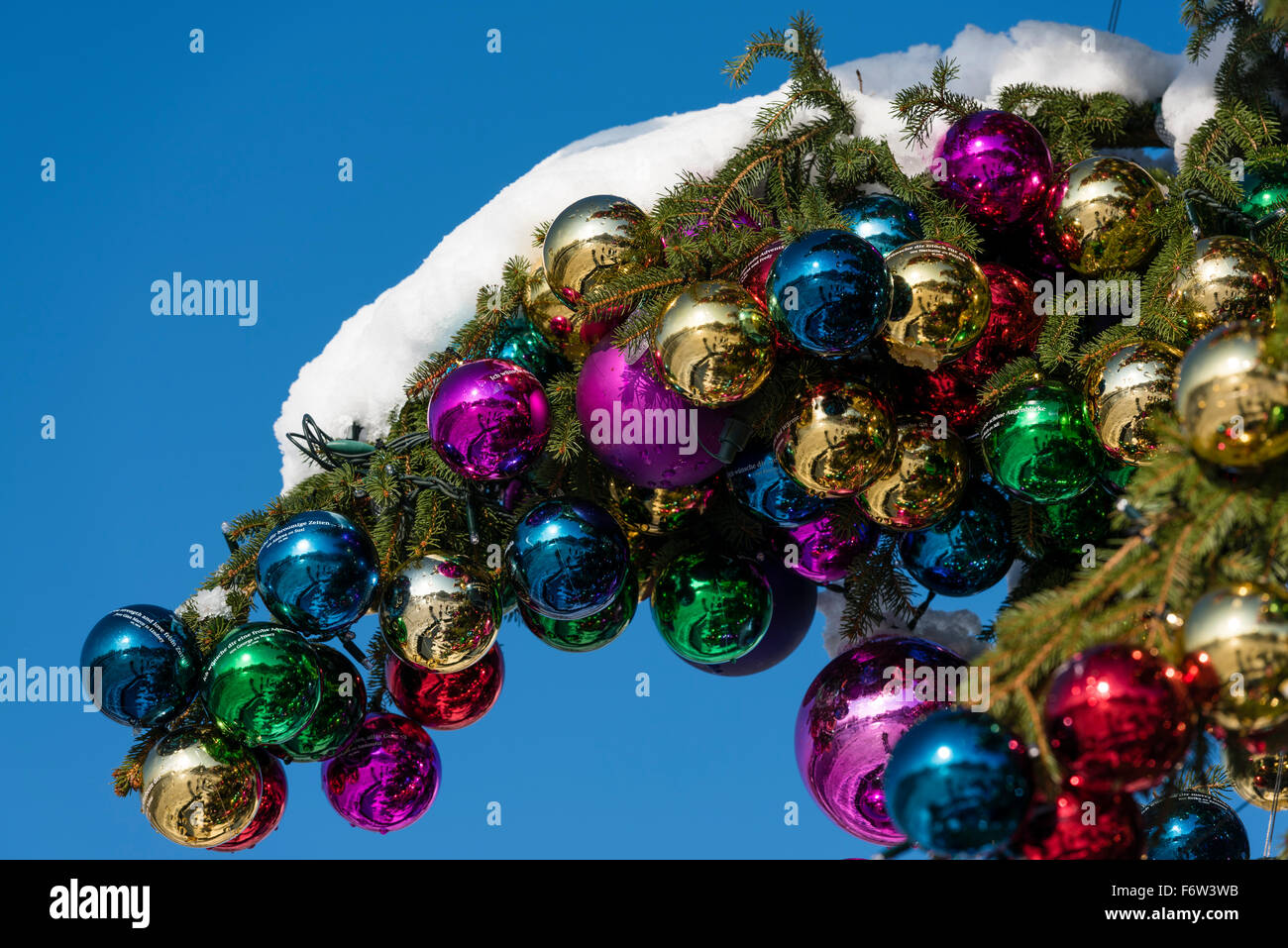 Colourful Christmas ball ornaments on a giant Christmas tree on Saechselaeutenplatz, outside Zurich Opera house, Switzerland. Stock Photo