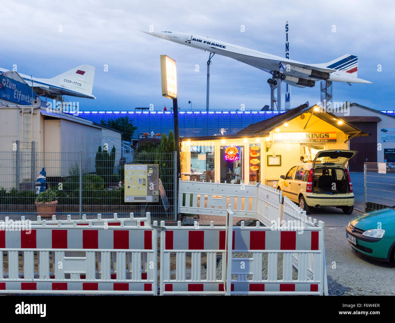 A discarded Tupolev Tu-144 and a Concorde supersonic passenger aircraft, both on display at the rooftop of a German museum. Stock Photo