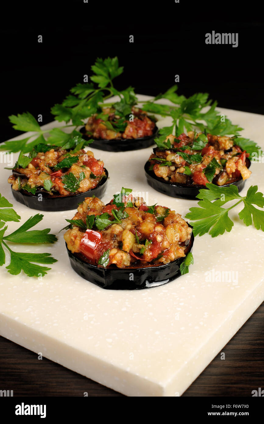 Appetizer of fried eggplant stuffed with vegetables, herbs Stock Photo