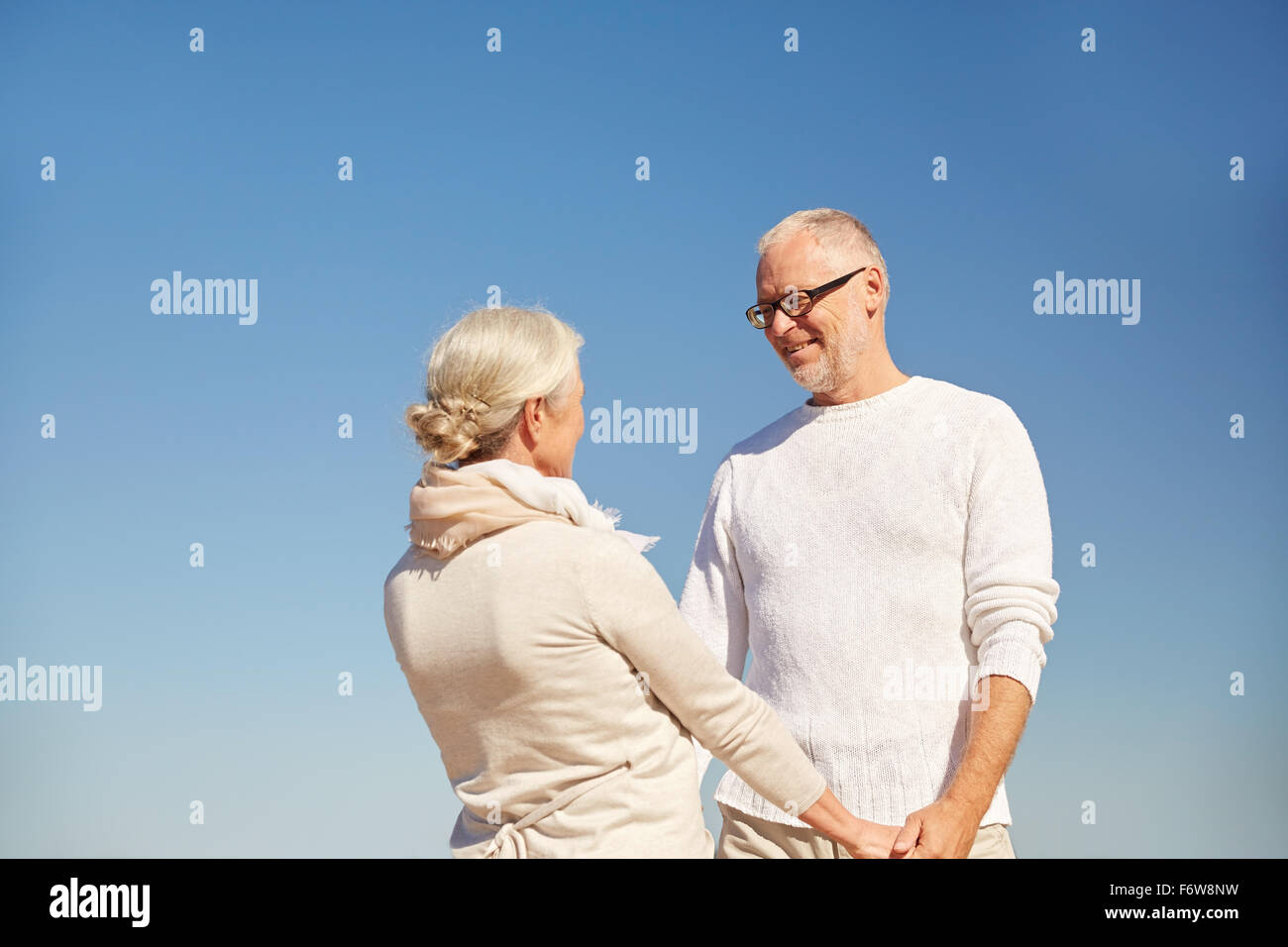 Cheerful man talking holding hands hi-res stock photography and images ...