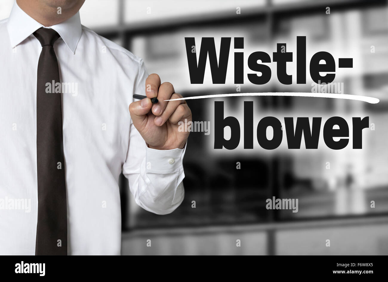 Whistleblower is written by businessman background concept. Stock Photo