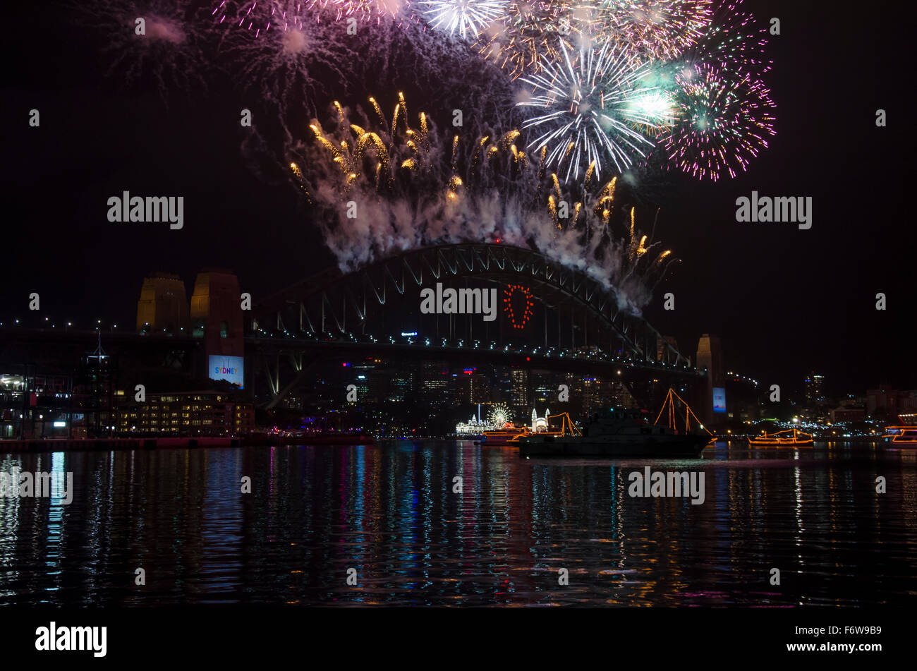 The Sydney Harbour Bridge on New Years Eve 2014 with fireworks exploding on the bridge in Australia Stock Photo