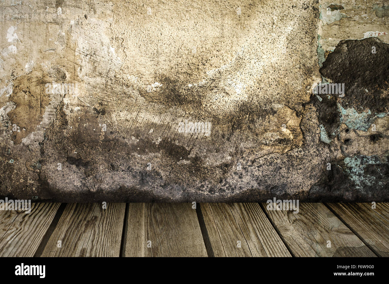 Grunge wall with wooden plank floor Stock Photo
