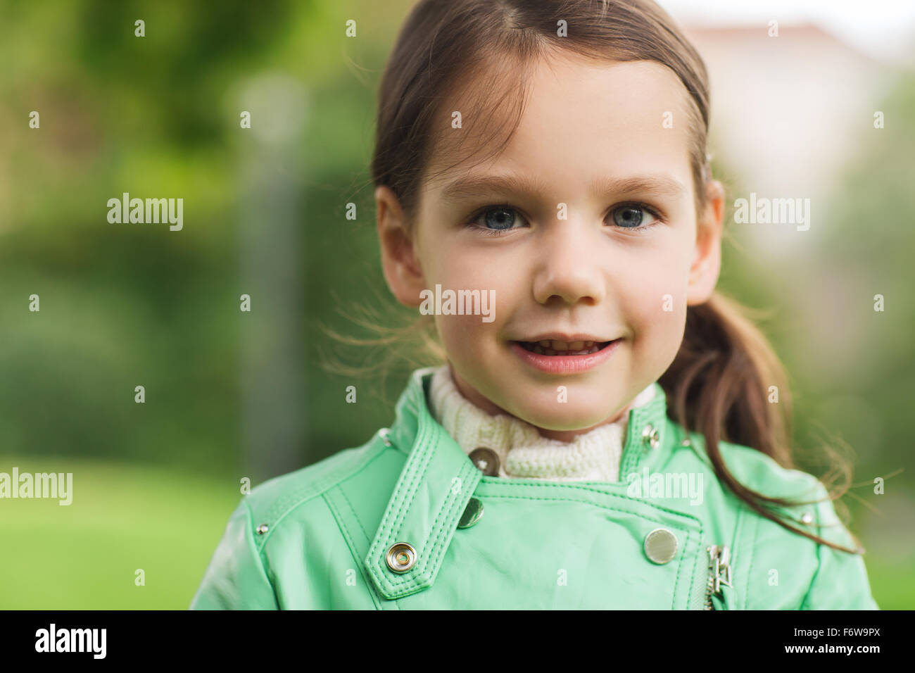 happy beautiful little girl portrait outdoors Stock Photo - Alamy