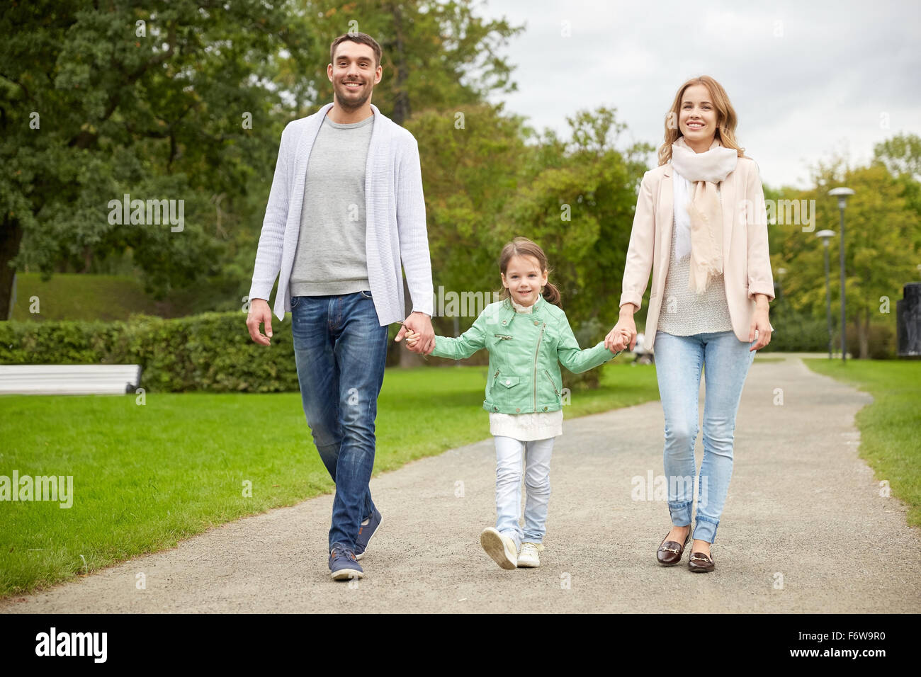 happy family walking in summer park Stock Photo - Alamy
