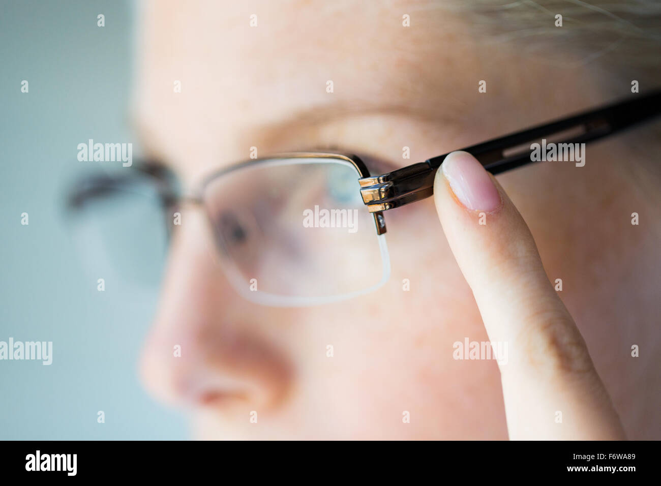 close up of woman in eyeglasses Stock Photo