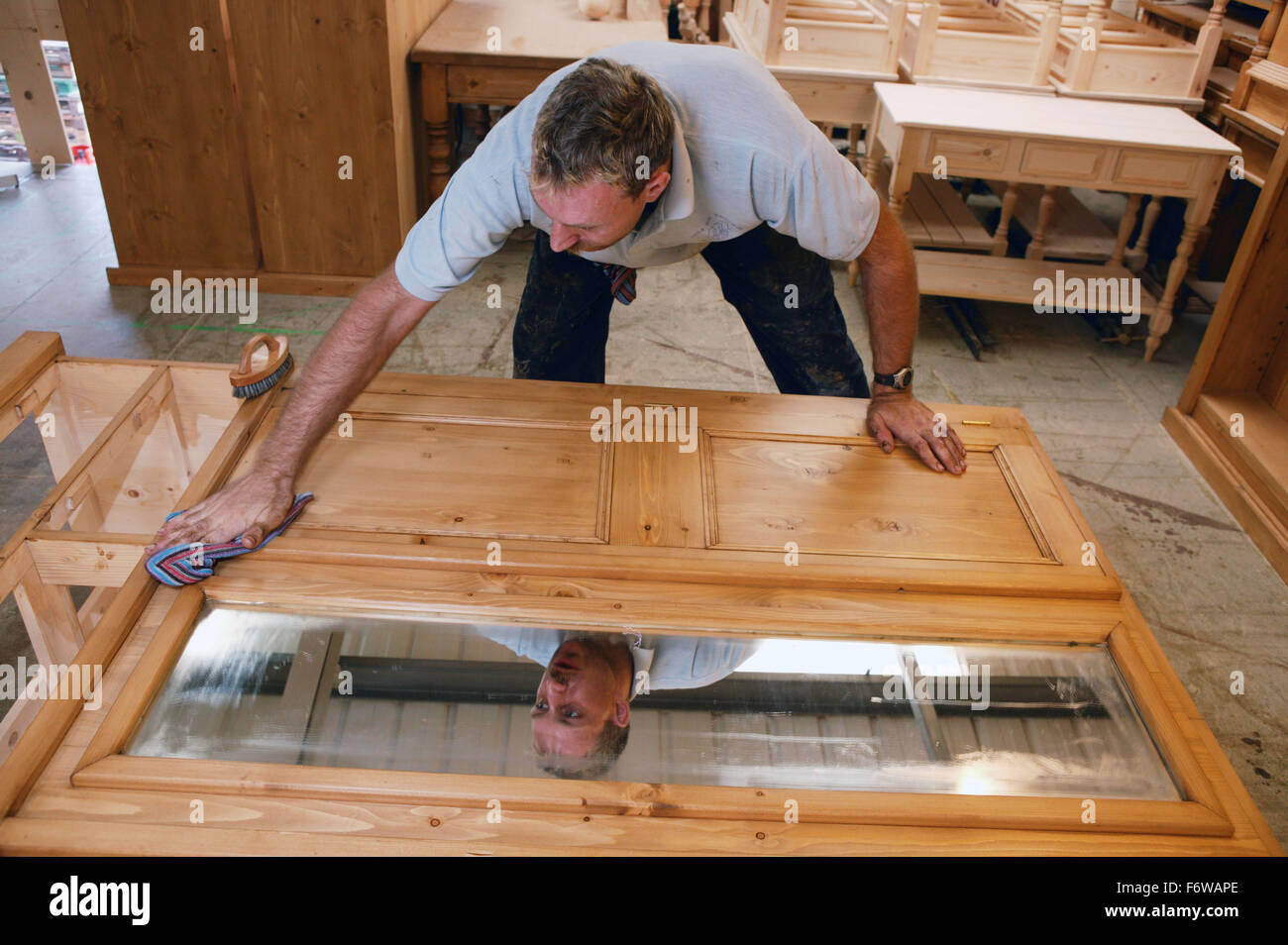 Man With Learning Disabilities Making Pine Furniture Stock Photo