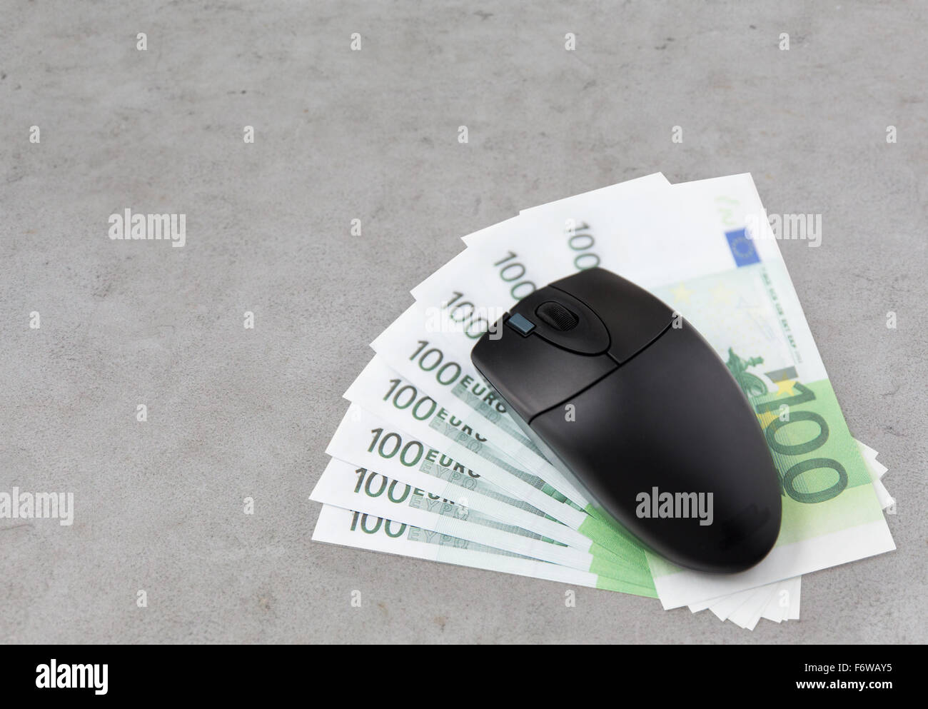 close up of computer mouse and euro cash money Stock Photo