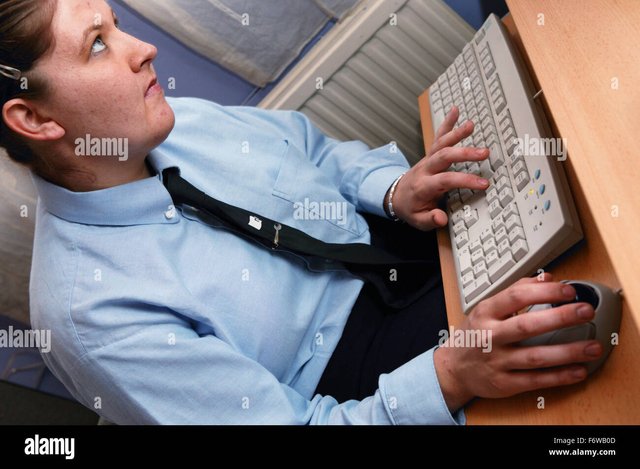 Woman with learning disabilities having a computer lesson Stock Photo