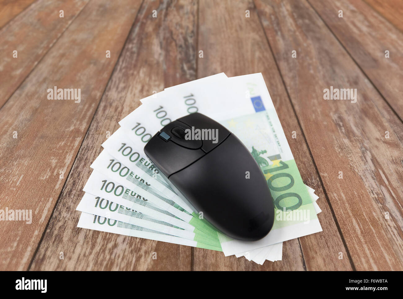 close up of computer mouse and euro cash money Stock Photo