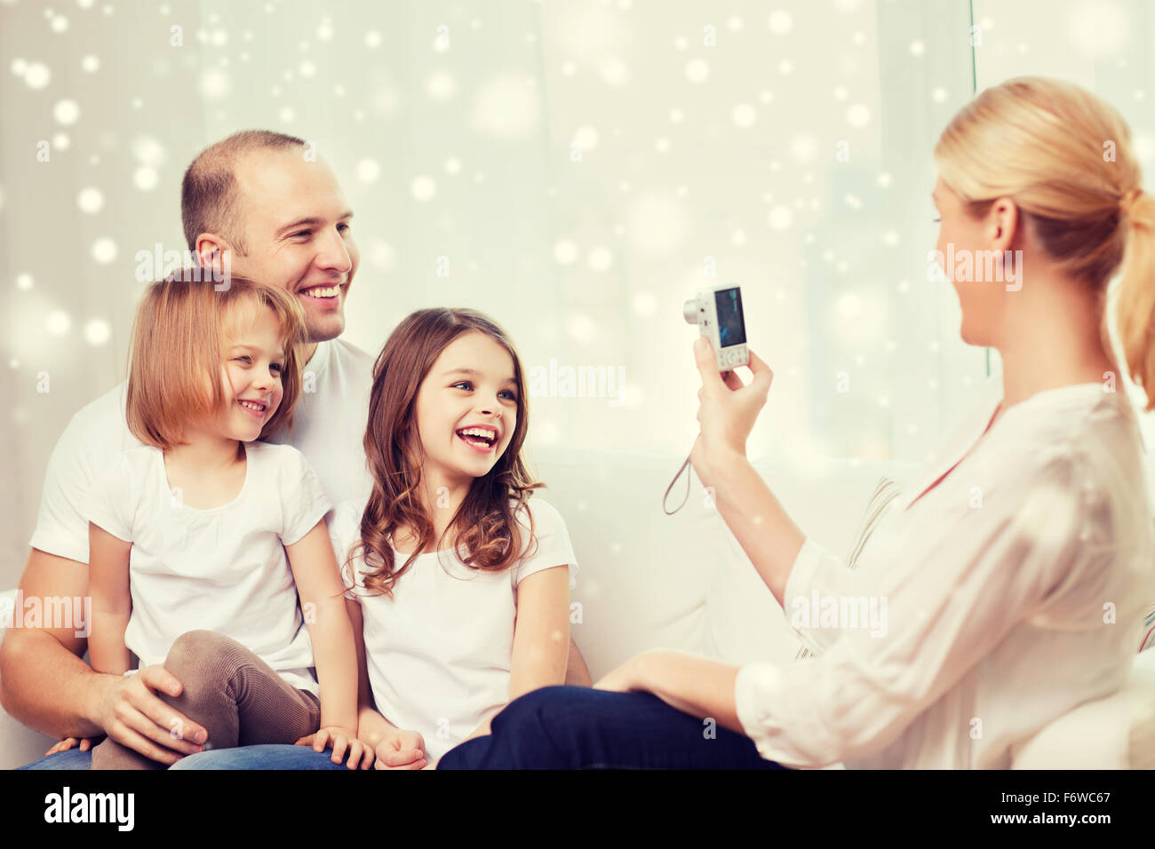 happy family with camera taking picture at home Stock Photo - Alamy