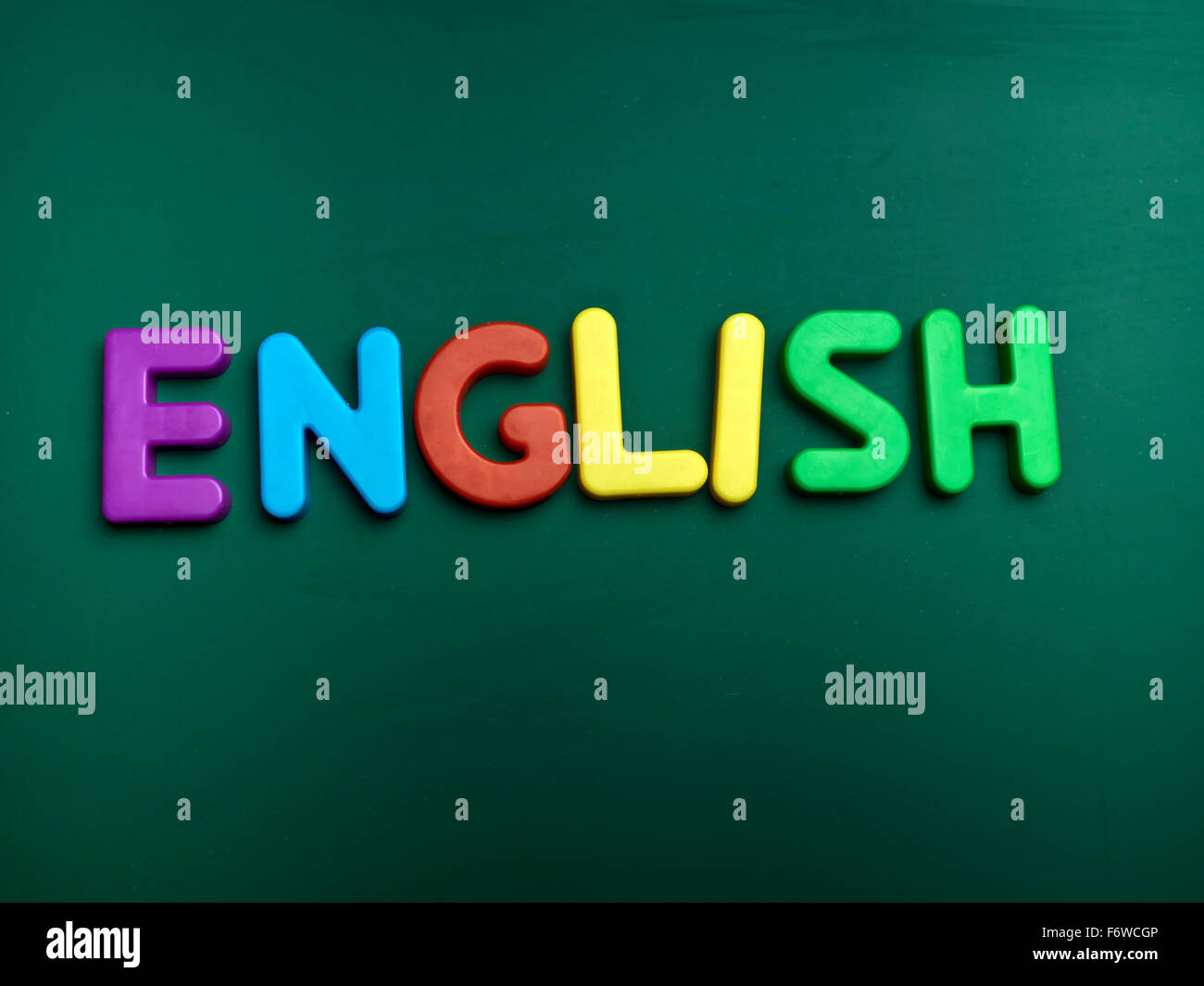 english language concept in colorful letters isolated on blank blackboard Stock Photo