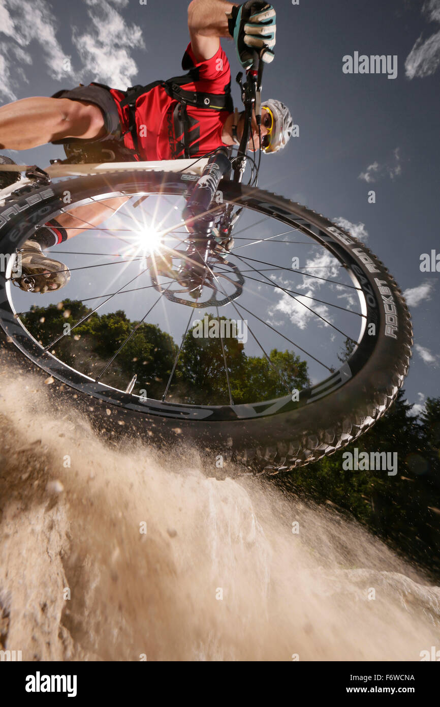 Mountain biker off-roading, Eckbauer, Garmisch-Partenkirchen, Bavaria, Germany Stock Photo