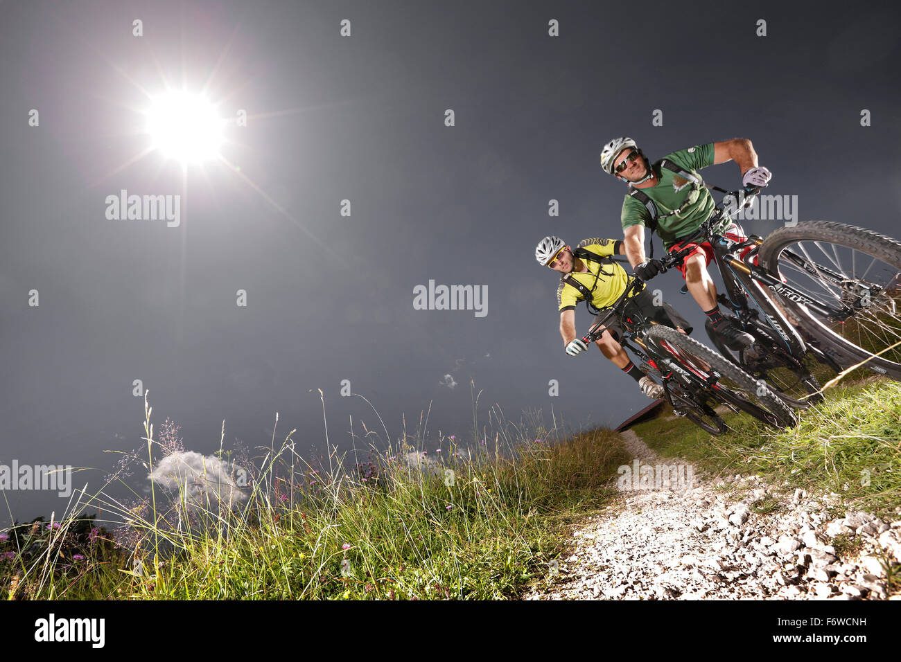 Two mountain bikers off roading, Eckbauer, Garmisch-Partenkirchen, Bavaria, Germany Stock Photo