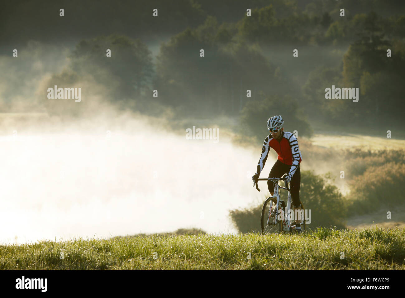 Man cyclocross touring in autumn, Degerndorf, Munsing, Bavaria, Germany