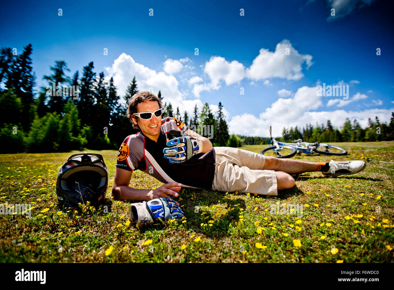 Downhill mountain biker resting, Frauenalpe, Murau, Styria, Austria Stock Photo