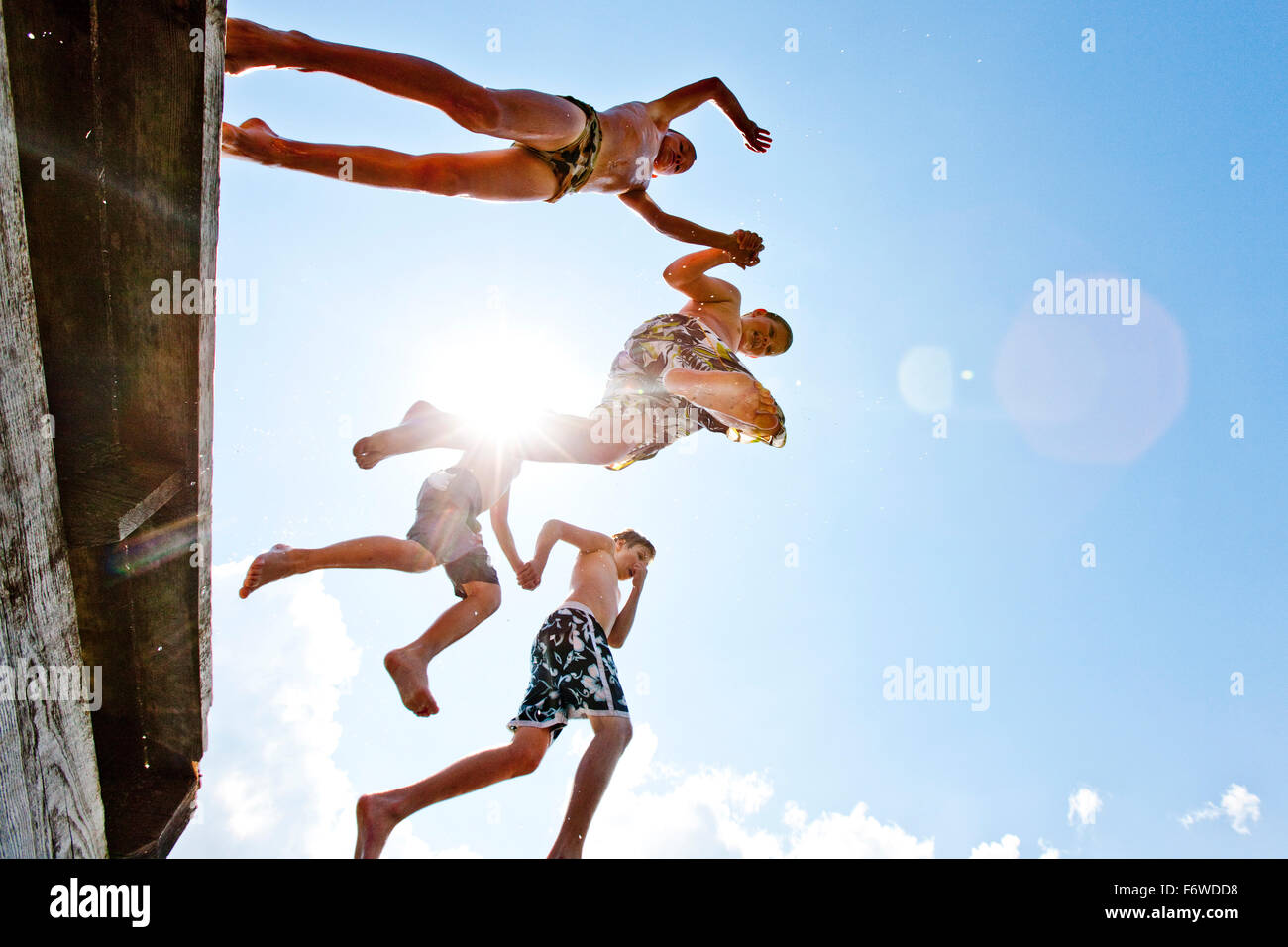 Children jumping into Furtnerteich, Mariahof, Murtal, Styria, Austria Stock Photo
