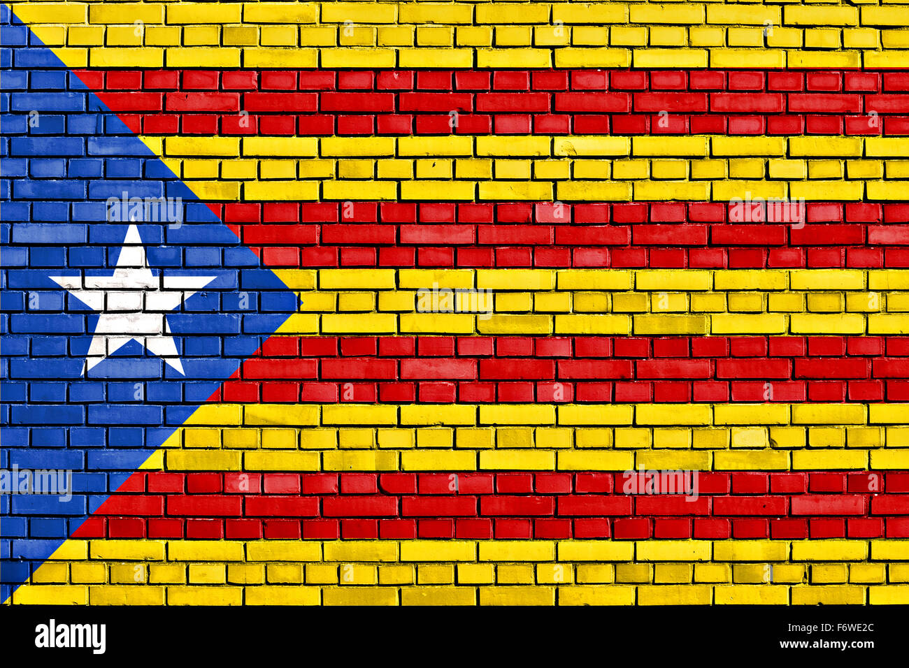 flag of Catalan independence movement painted on brick wall Stock Photo