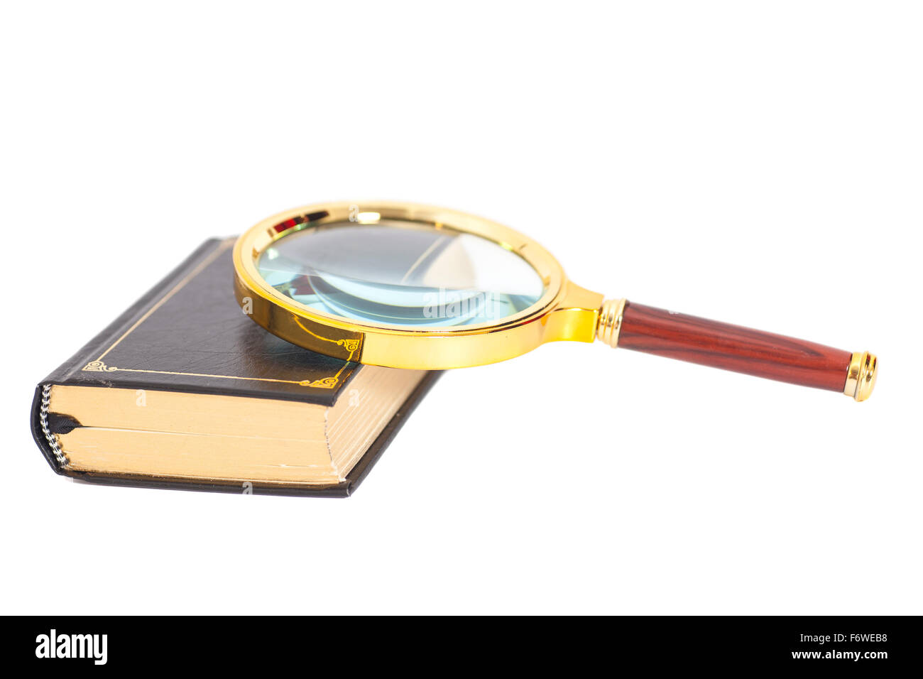 book with magnifying glass over white background Stock Photo - Alamy