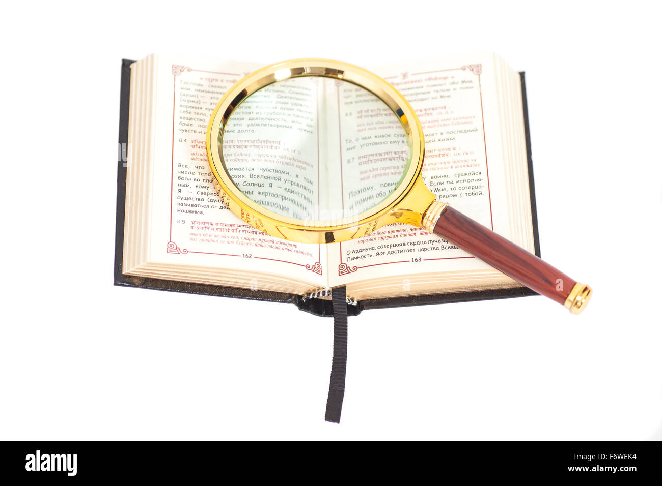 Open Book with magnifying glass over white background Stock Photo Alamy