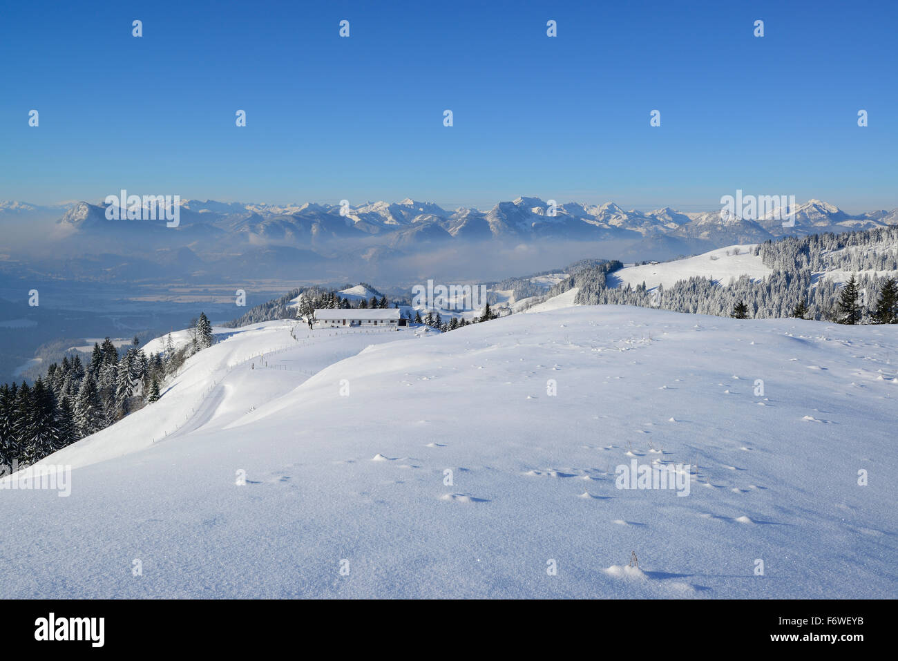 Snow-covered alps at Brennkopf, valley of Inn and Mangfall range in background, Brennkopf, Chiemgau range, Tyrol, Austria Stock Photo
