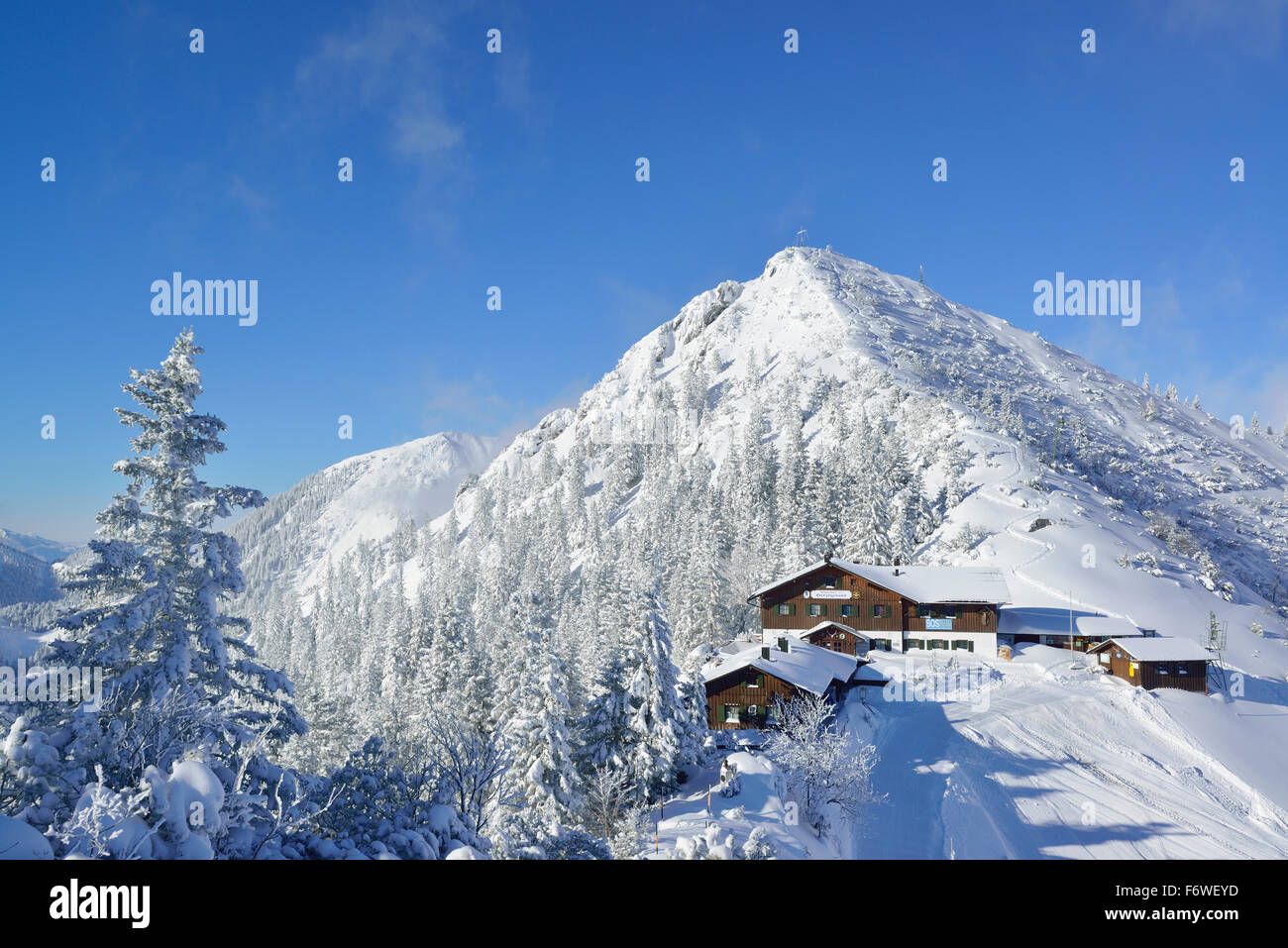 View to snow-covered Herzogstand and Herzogstandhaus, Herzogstand, Bavarian Alps, Upper Bavaria, Bavaria, Germany Stock Photo