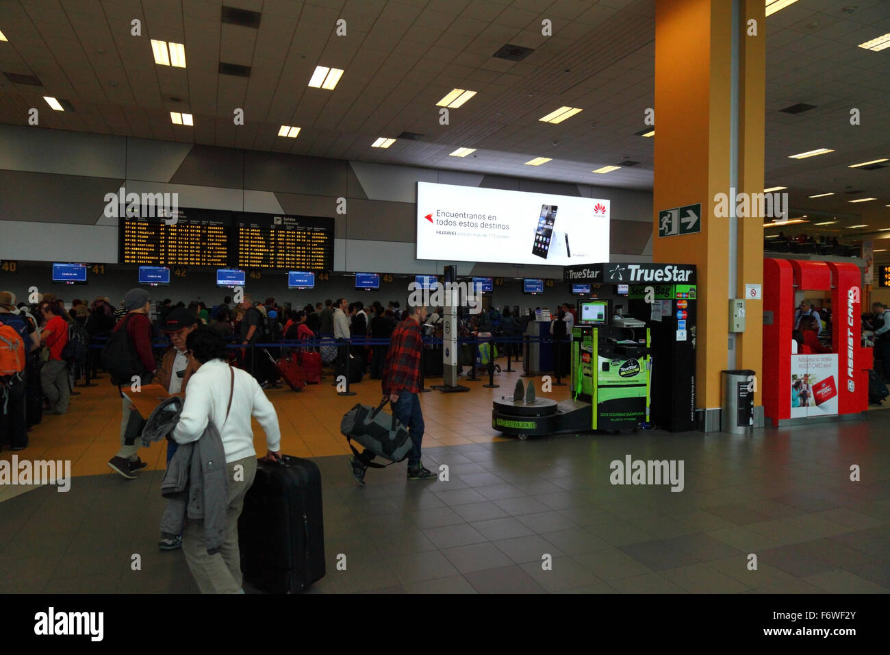 TrueStar luggage wrapping machine in check in area at Jorge Chávez International Airport, Callao, Lima, Peru Stock Photo