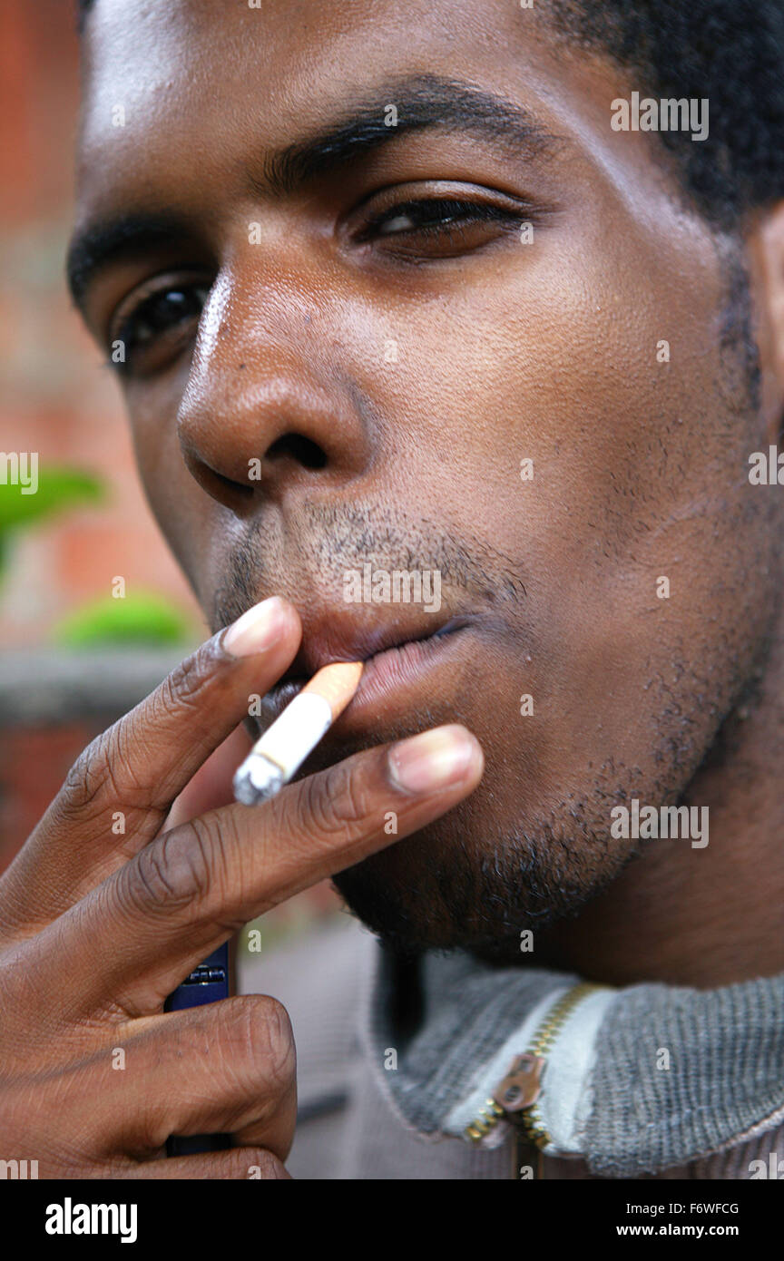 Youth smoking a cigarette outside Stock Photo Alamy
