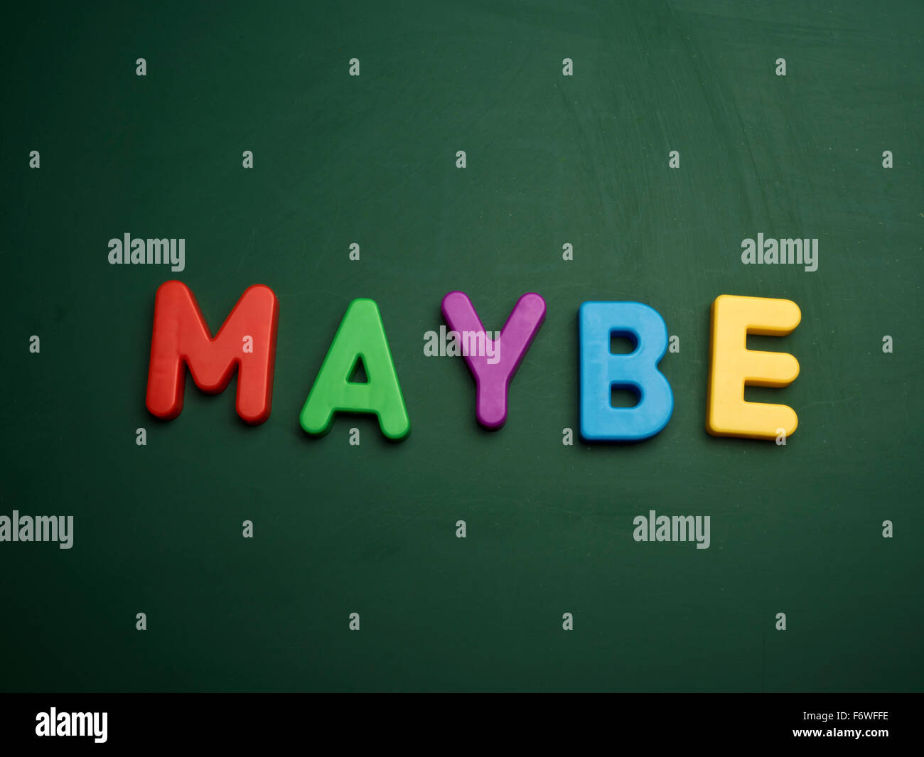 maybe concept in colorful letters isolated on blank blackboard Stock Photo