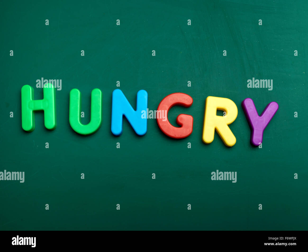 hungry concept in colorful letters isolated on blank blackboard Stock Photo