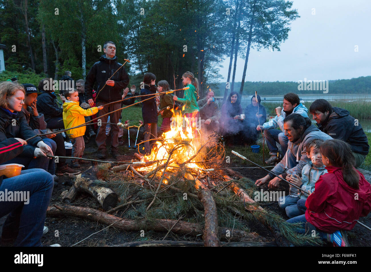 Campfire at campground at lake Ellbogensee, Mecklenburg Lake District, Mecklenburg-Western Pomerania, Germany Stock Photo