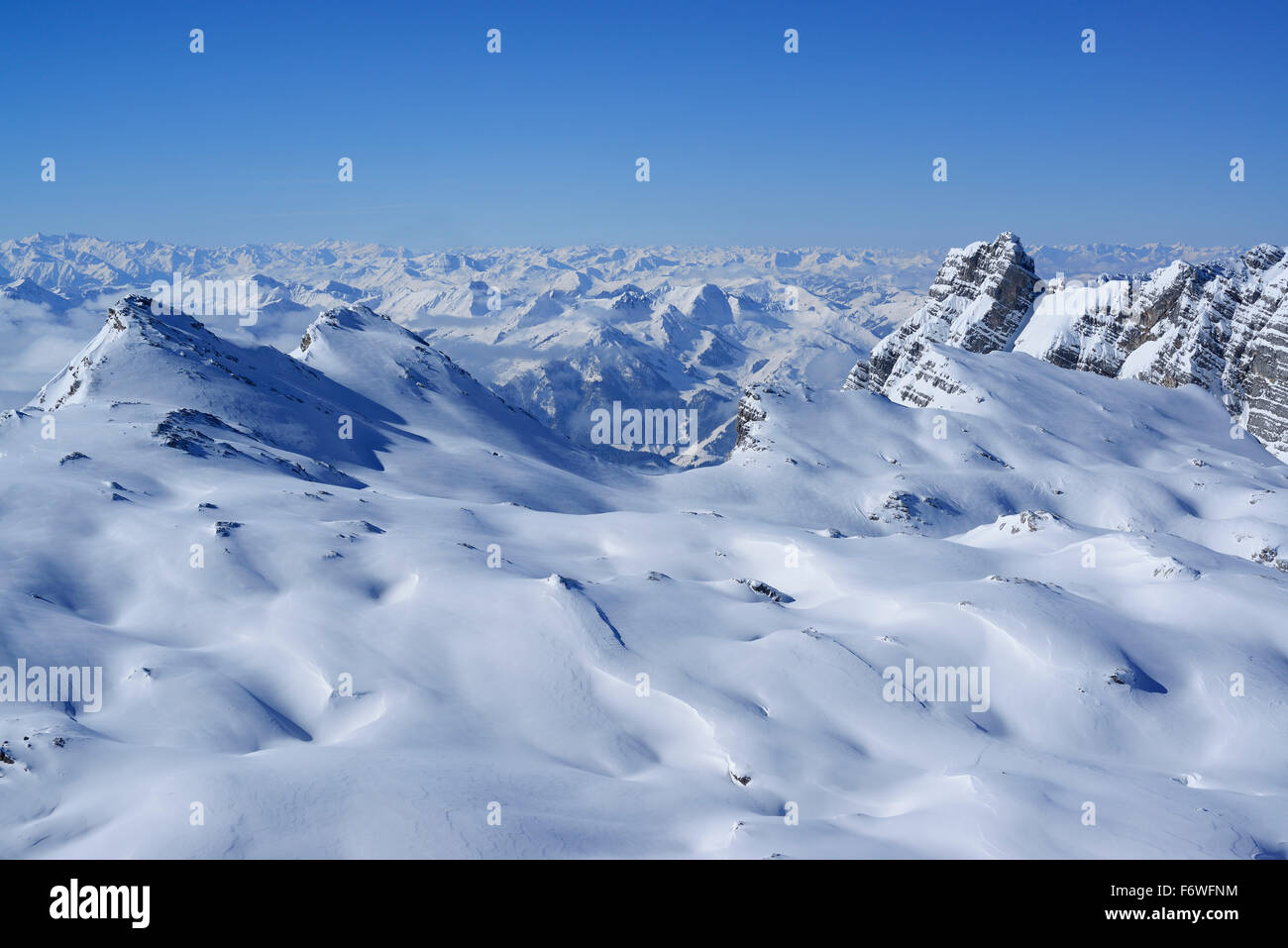 Snow-covered cirque with view to Central Alps, Birnhorn, Ebersbergkar, Leoganger Steinberge range, Salzburg, Austria Stock Photo
