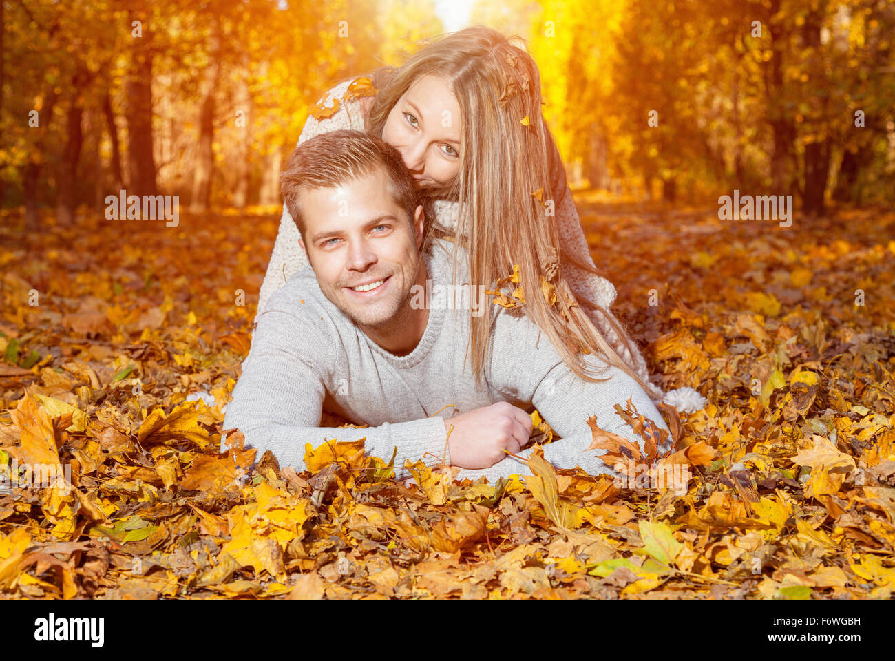 Beautiful young couple laying hi-res stock photography and images - Alamy