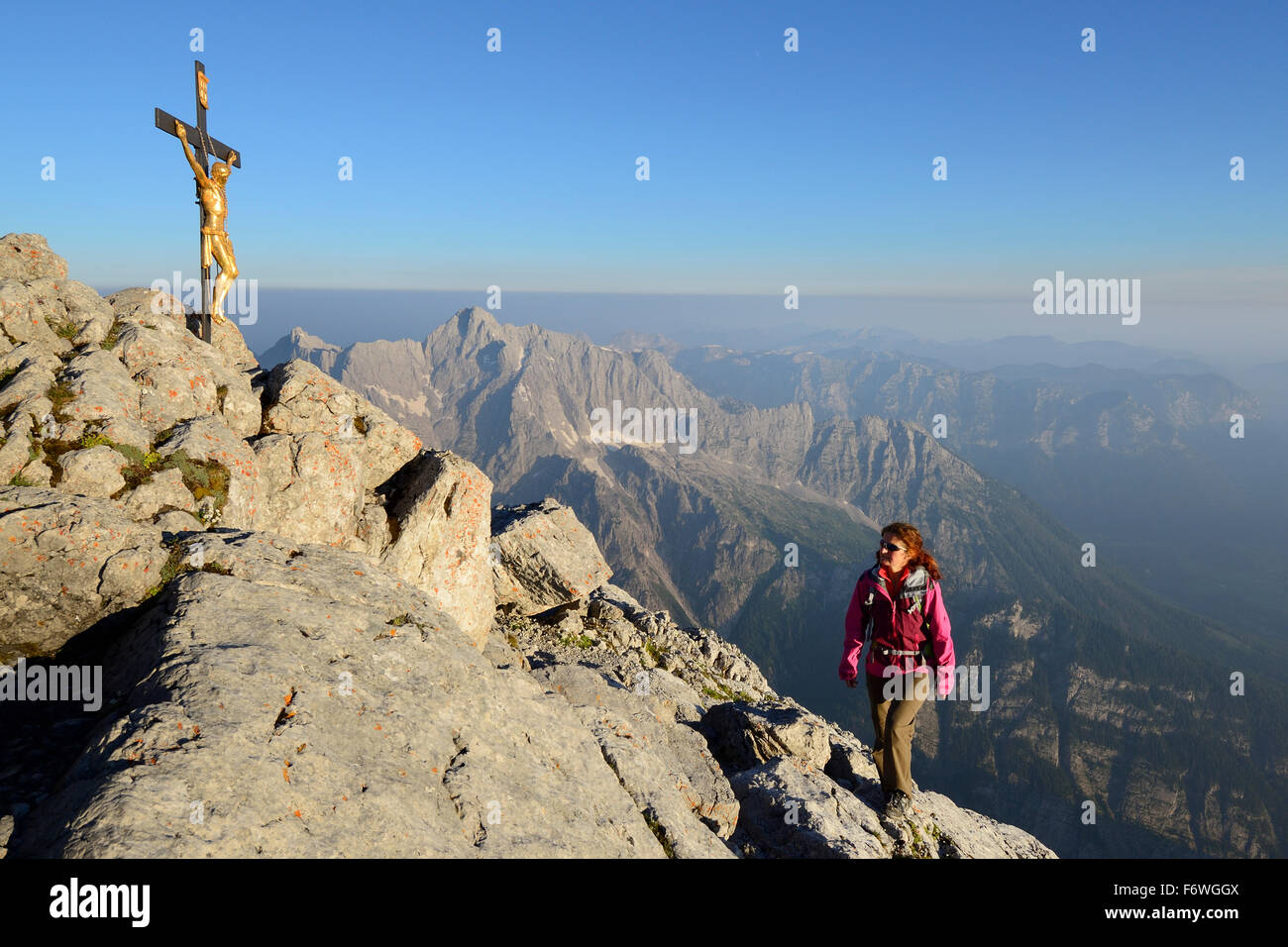 Woman ascending to Hocheck, Hochkalter in background, Watzmann, Berchtesgaden Alps, Berchtesgaden National Park, Berchtesgaden, Stock Photo