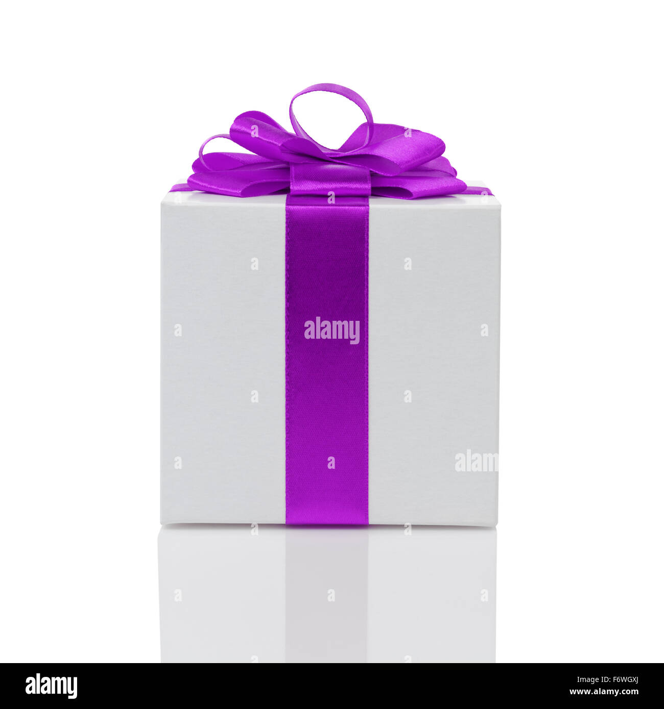white paper gift box with purple ribbon bow isolated Stock Photo