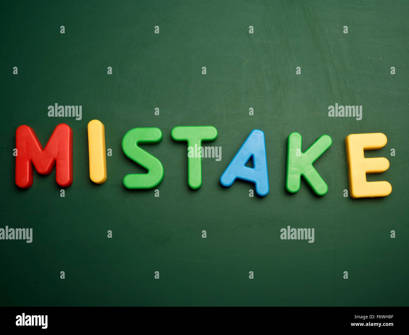 mistake concept in colorful letters isolated on blank blackboard Stock Photo