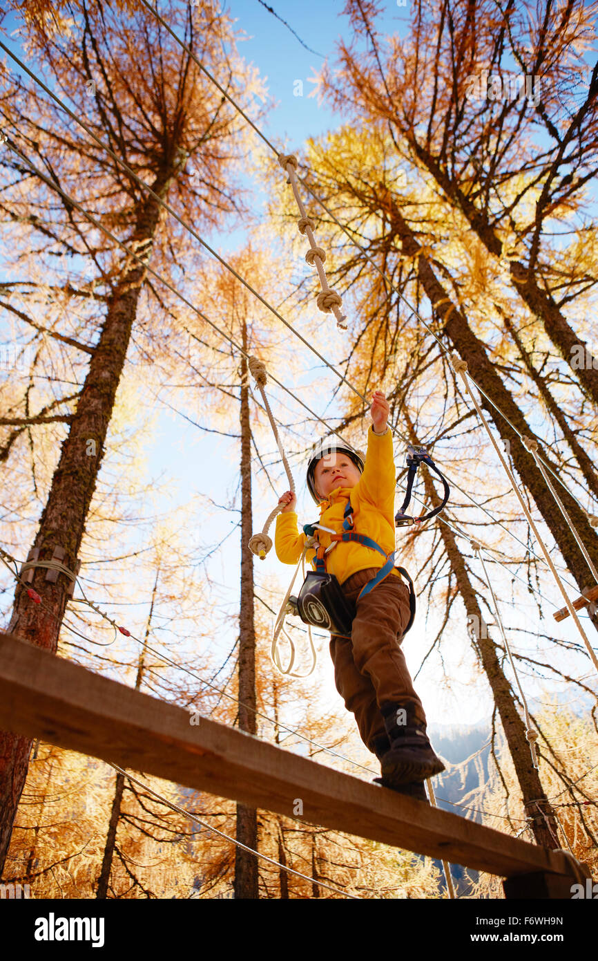 Boy in a high ropes course, Vernagt am See, Schnals Valley, South Tyrol ...