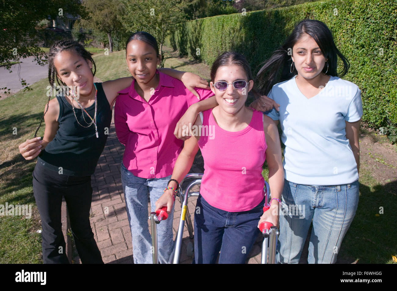 Group of teenaged friends out in the park together, Stock Photo
