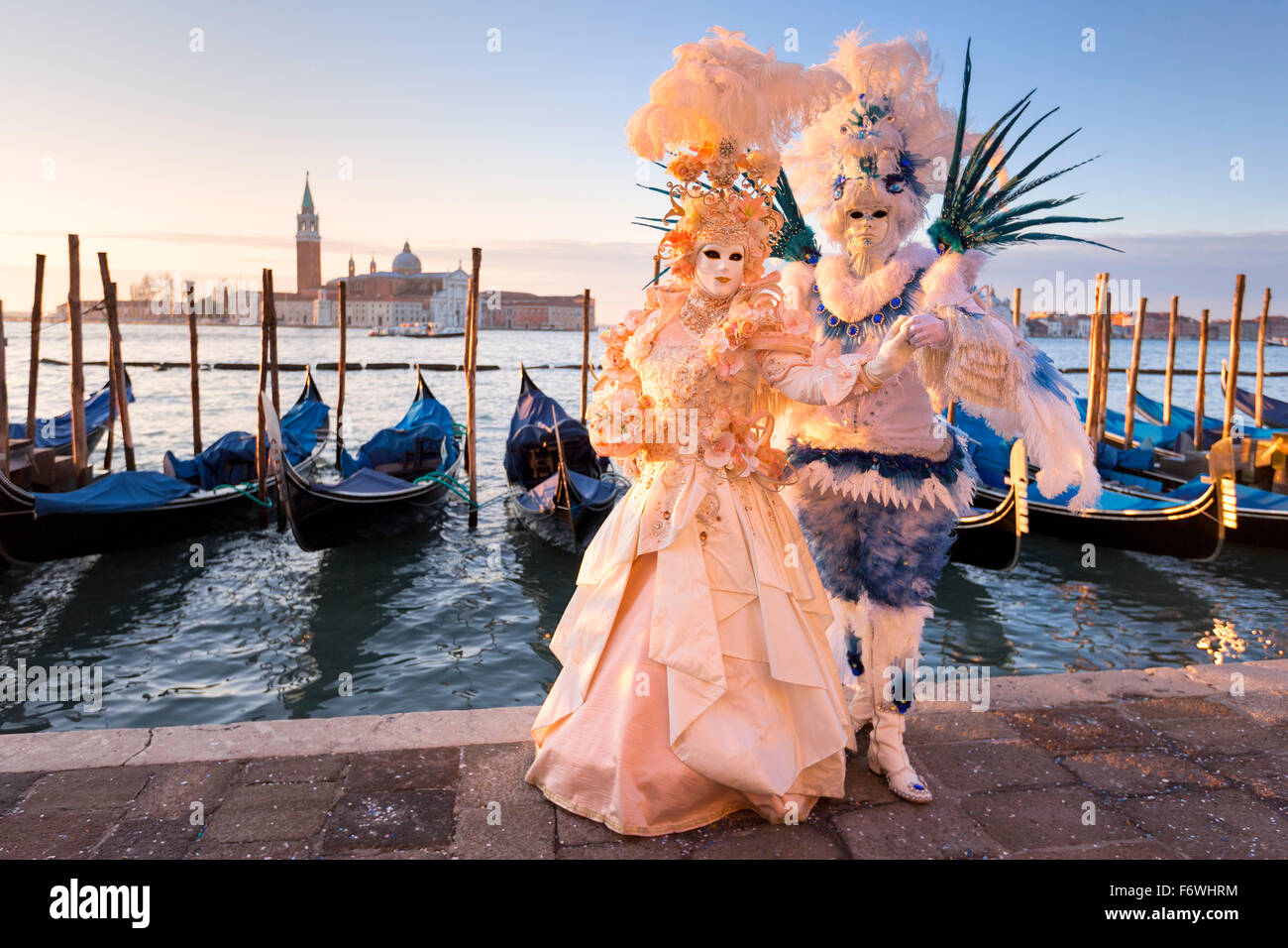 Couple wearing traditional costumes and masks, Carnival of Venice, Veneto, Italy Stock Photo