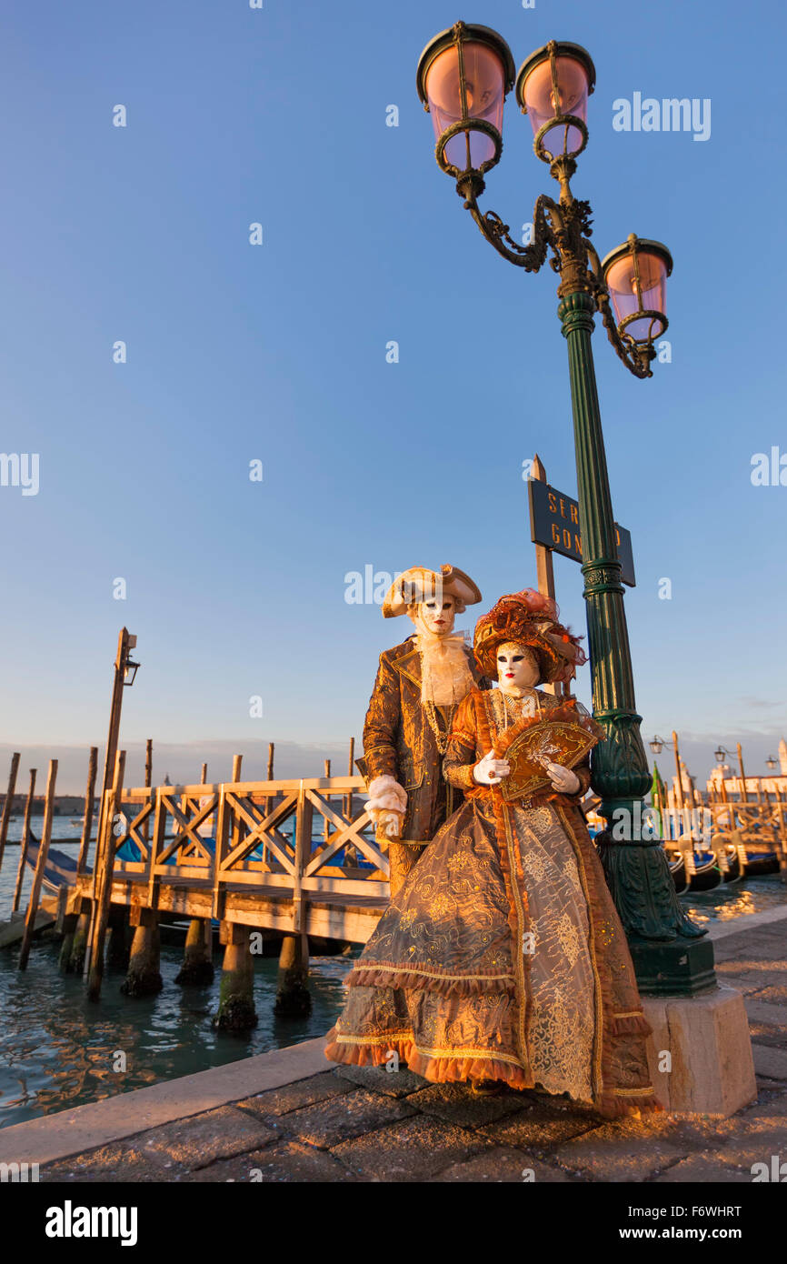 Couple wearing traditional costumes and masks, Carnival of Venice, Veneto, Italy Stock Photo