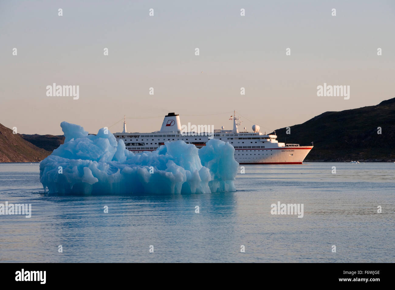 Iceberg and cruise ship MS Deutschland  Reederei Peter Deilmann , Narssaq, Kitaa, Greenland Stock Photo