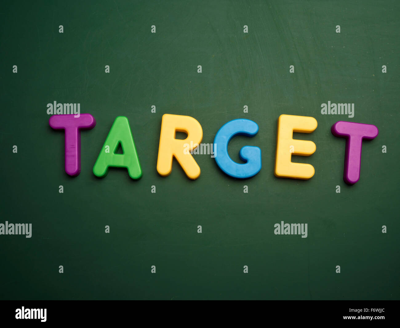 target concept in colorful letters isolated on blank blackboard Stock Photo