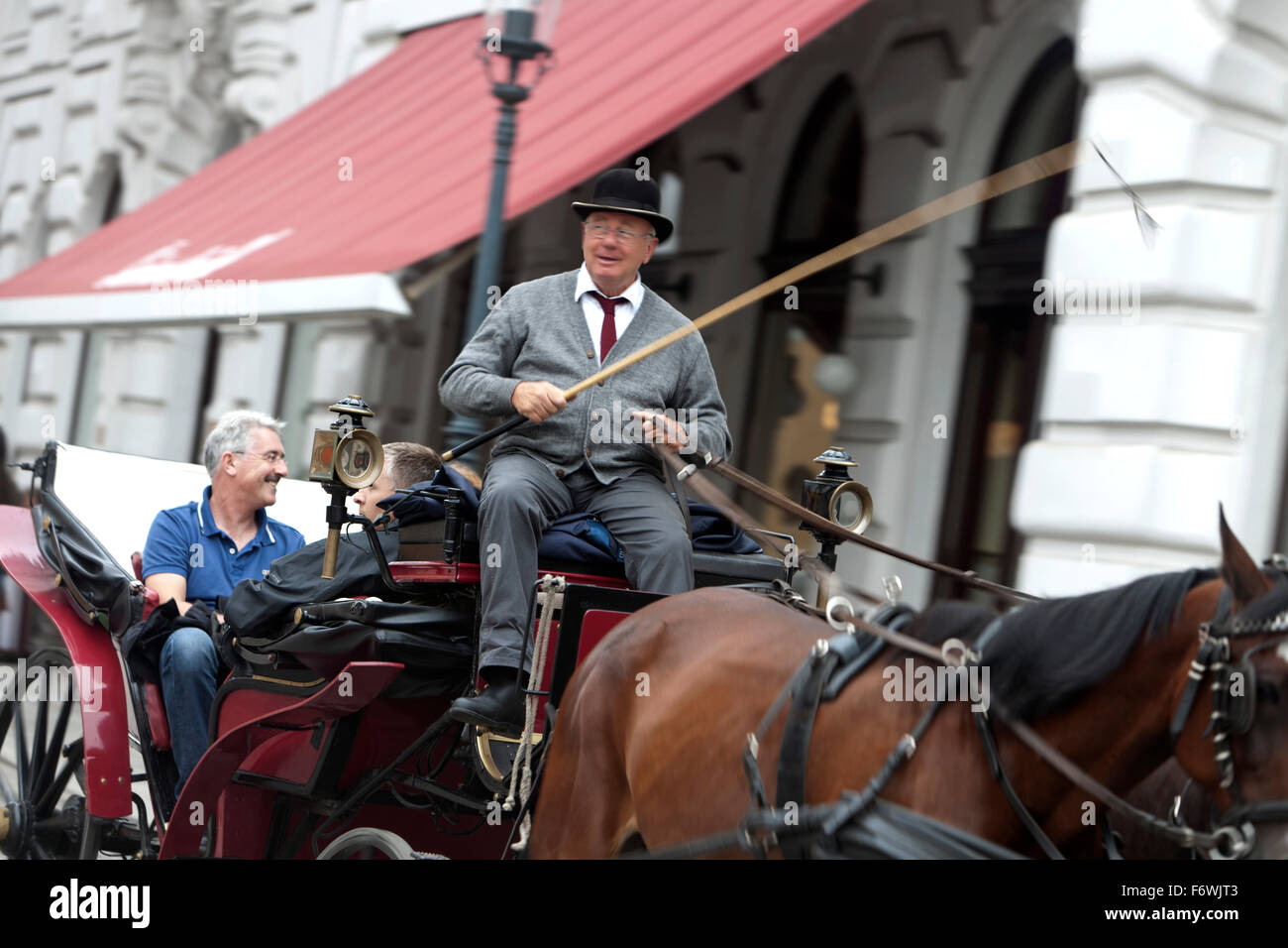 Fiaker and horse-drawn carriage on Michaelerplatz, Vienna, Austria Stock Photo
