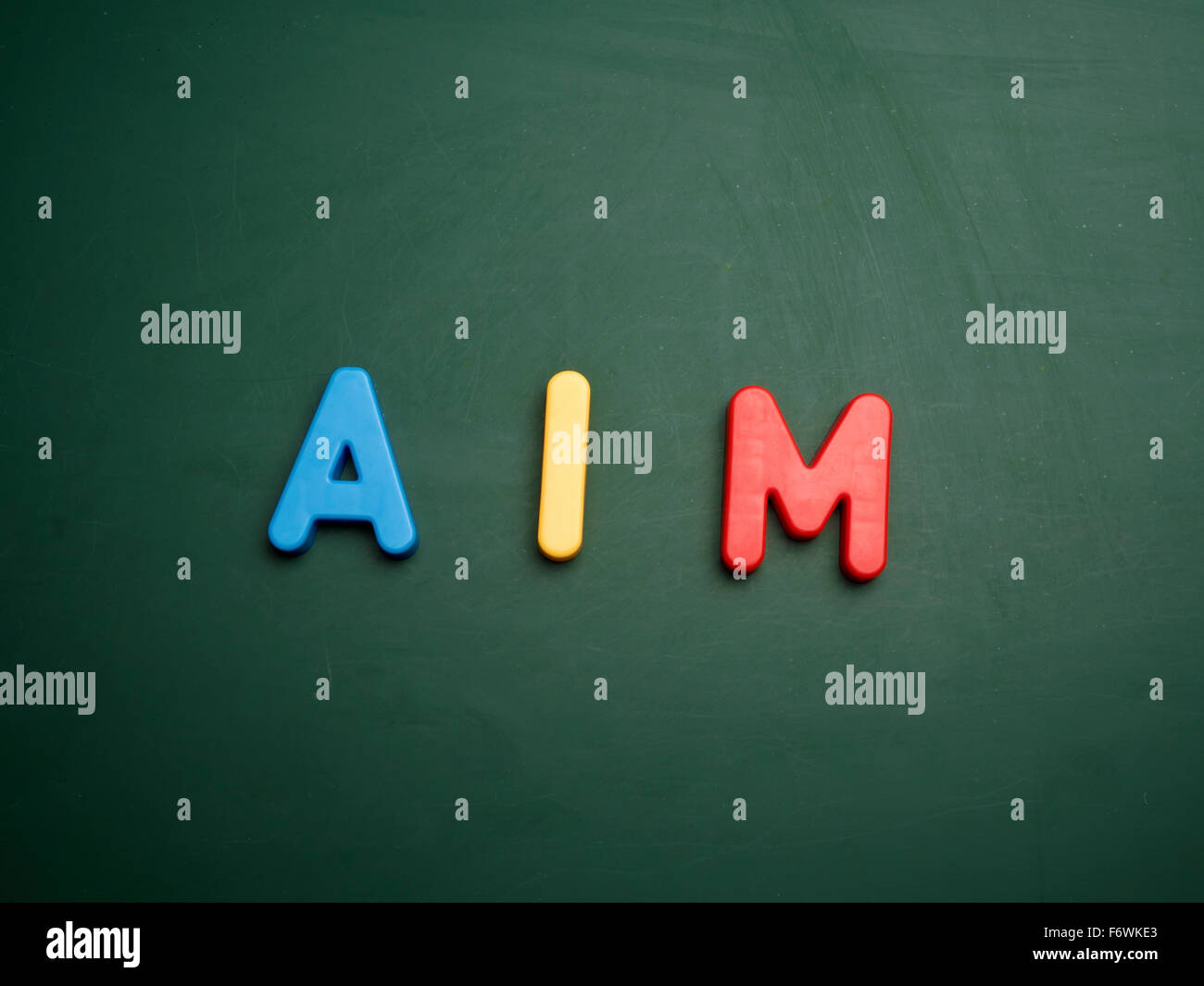 aim concept in colorful letters isolated on blank blackboard Stock Photo