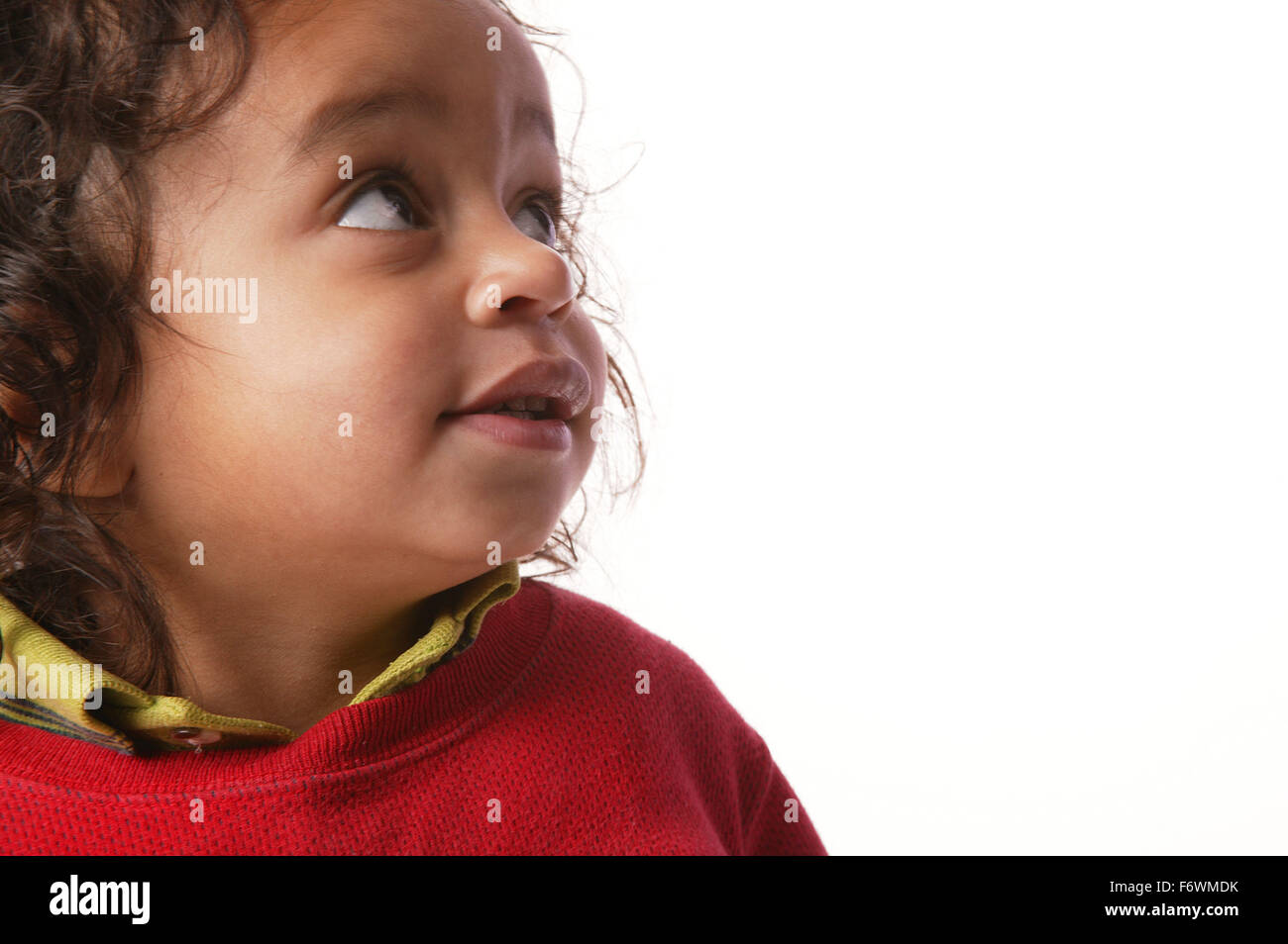 Side Portrait of a toddler gazing upwards, Stock Photo