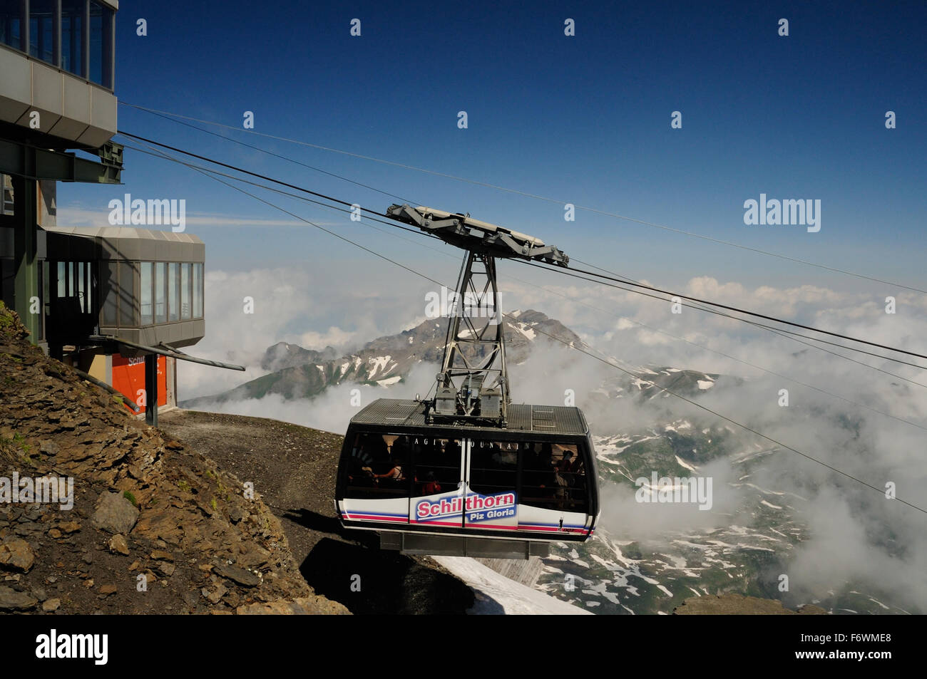 Cablecar arriving at the summit of the Schilthorn (2970m), the location of the Piz Gloria revolving restaurant. Stock Photo